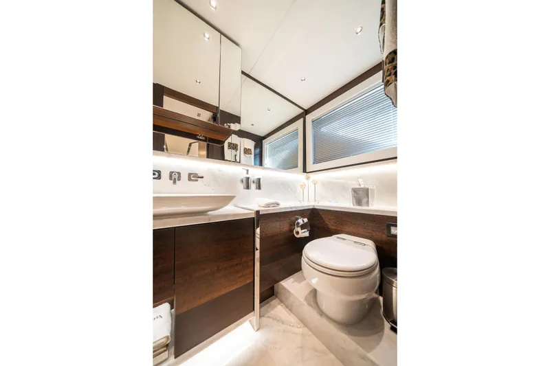 Lorena Yacht Photos Pics Luxurious bathroom in 2022 Sunseeker Predator 65 yacht, featuring modern fixtures and elegant design.
