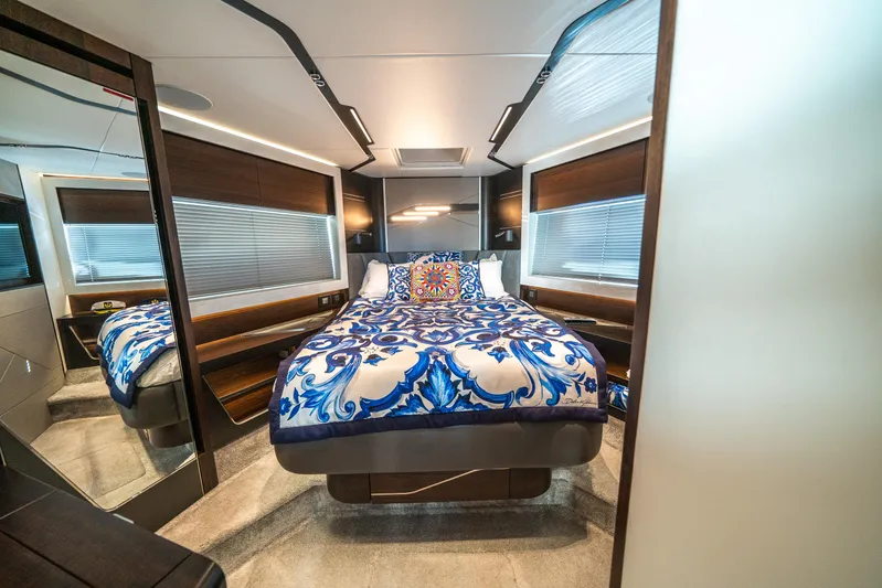 Lorena Yacht Photos Pics Luxurious bedroom interior of 2022 Sunseeker Predator 65 yacht with elegant bedding.