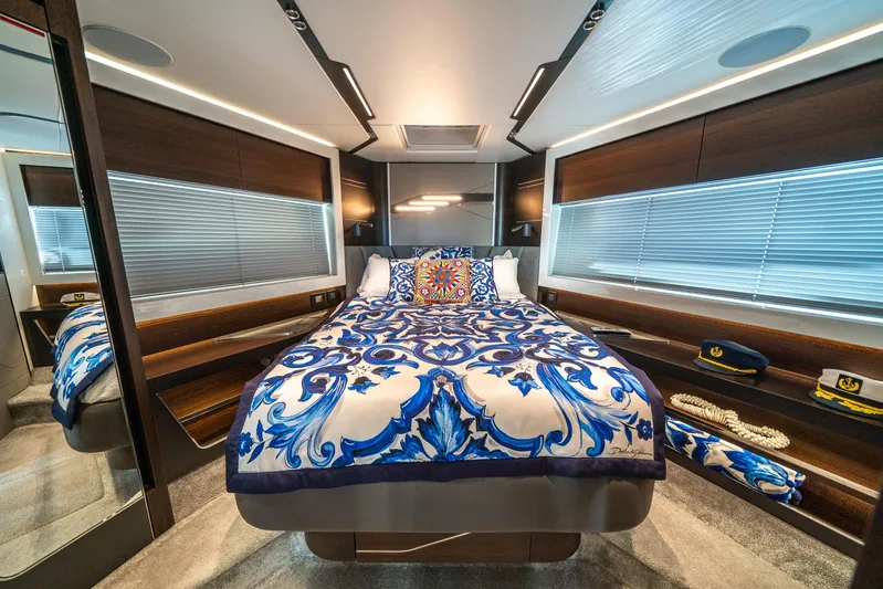 Lorena Yacht Photos Pics Luxurious bedroom interior of 2022 Sunseeker Predator 65 yacht with elegant bedding and decor.