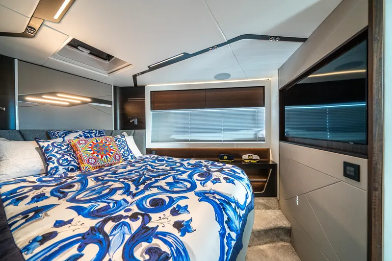 Lorena Yacht Photos Pics Luxurious bedroom interior of 2022 Sunseeker Predator 65 yacht with vibrant bedding.