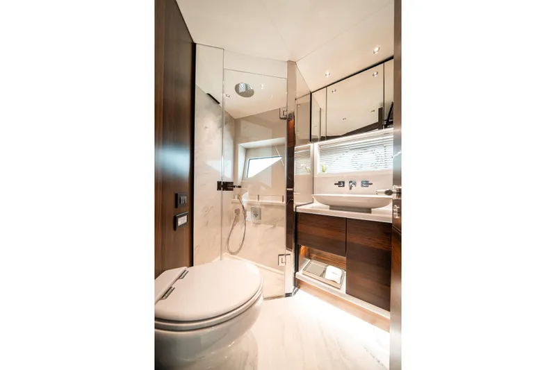 Lorena Yacht Photos Pics Luxurious bathroom in 2022 Sunseeker Predator 65 yacht, featuring modern fixtures and elegant design.
