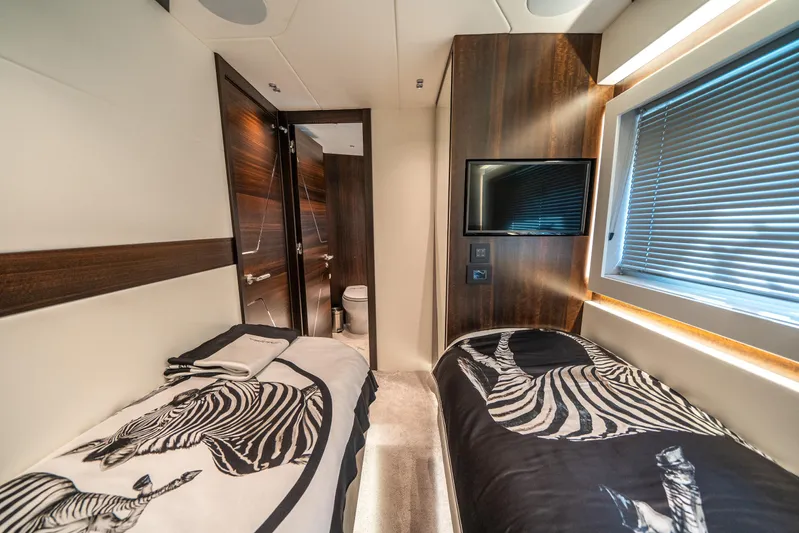 Lorena Yacht Photos Pics Luxurious cabin interior of 2022 Sunseeker Predator 65 yacht with zebra-themed bedding.