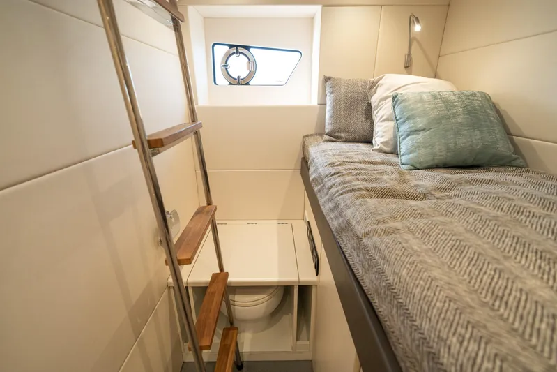 Lorena Yacht Photos Pics Interior cabin of 2022 Sunseeker Predator 65 yacht with bed and ladder.