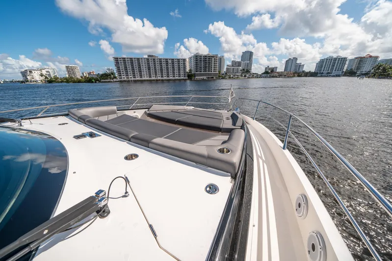 Lorena Yacht Photos Pics Sunseeker Predator 65 yacht deck with city skyline, 2022 model.