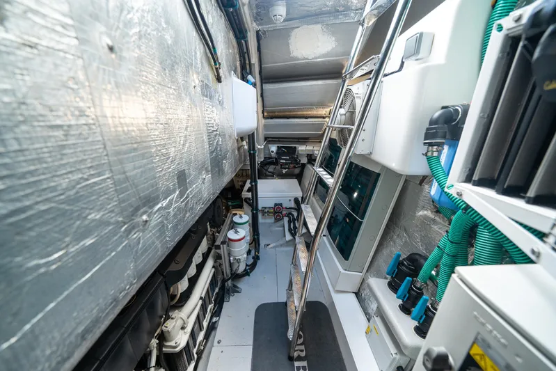 Lorena Yacht Photos Pics Engine room of 2022 Sunseeker Predator 65 yacht, showcasing mechanical components and equipment.