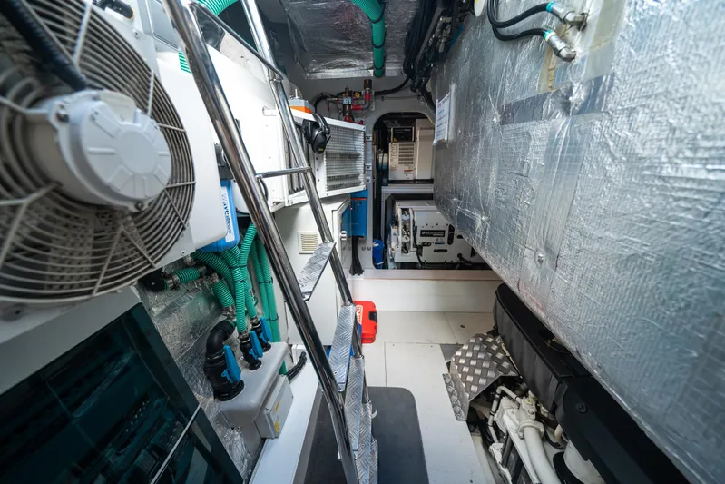 Lorena Yacht Photos Pics Engine room of 2022 Sunseeker Predator 65 yacht, showcasing mechanical components and systems.