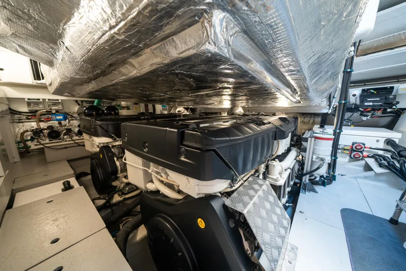 Lorena Yacht Photos Pics Engine room of 2022 Sunseeker Predator 65 yacht, showcasing advanced machinery and equipment.