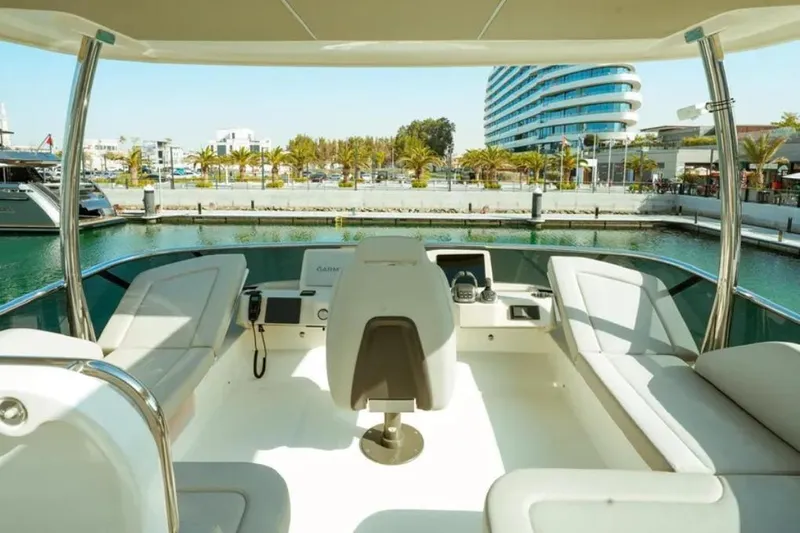  Yacht Photos Pics 2024 Absolute NAVETTA 52 yacht interior with modern seating and navigation equipment.