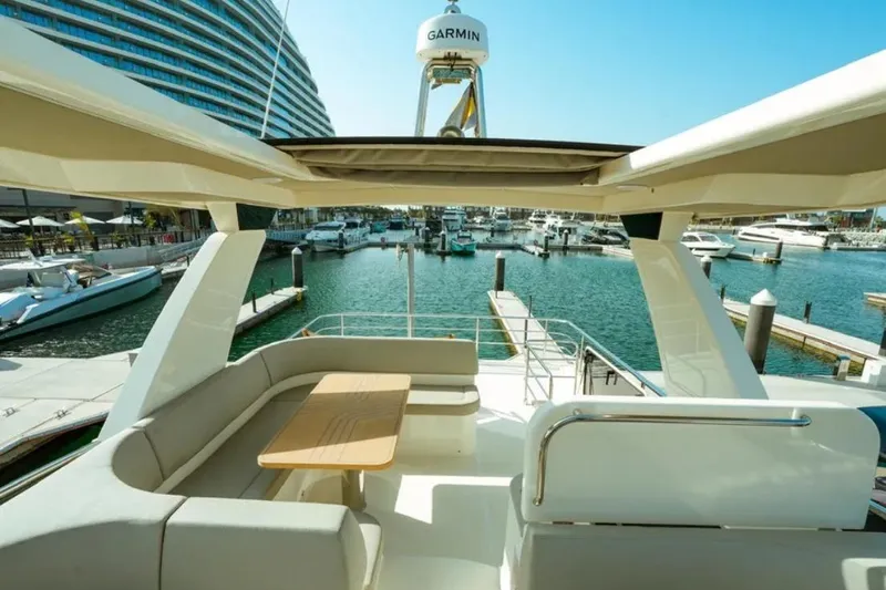  Yacht Photos Pics Luxurious 2024 Absolute NAVETTA 52 yacht interior with marina view.