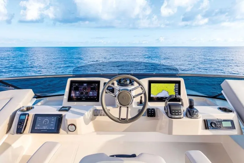  Yacht Photos Pics 2024 Absolute NAVETTA 52 yacht helm with advanced navigation systems and ocean view.