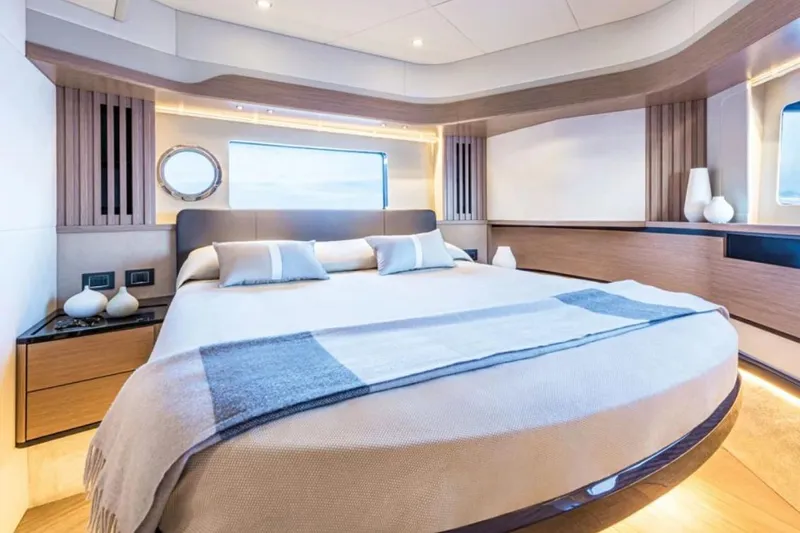  Yacht Photos Pics Luxurious bedroom interior of 2024 Absolute NAVETTA 52 yacht with modern design elements.