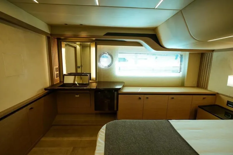  Yacht Photos Pics Luxurious interior of 2024 Absolute NAVETTA 52 yacht with modern furnishings and ample natural light.