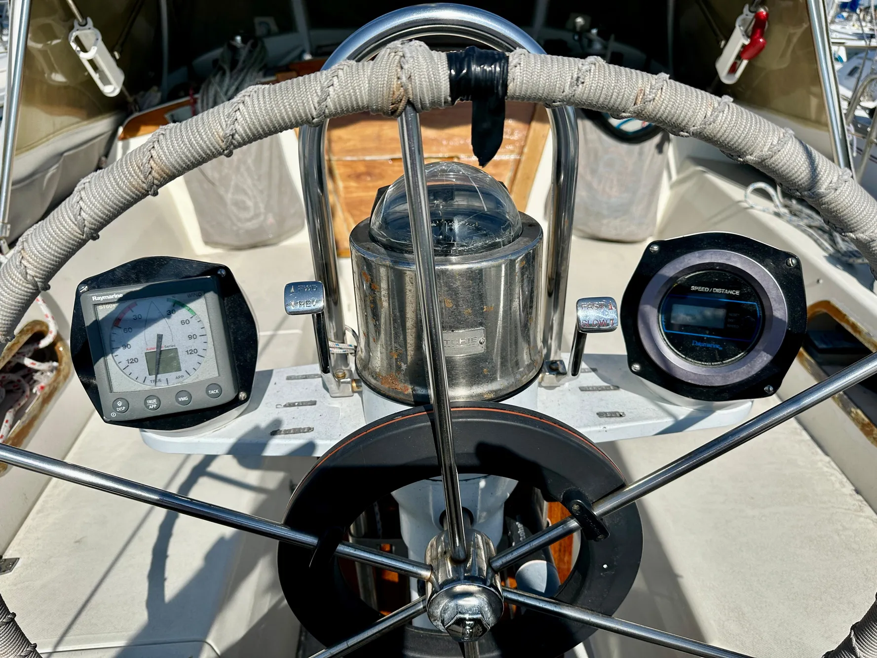 Steering wheel of a 1987 Catalina 34 yacht with instruments.