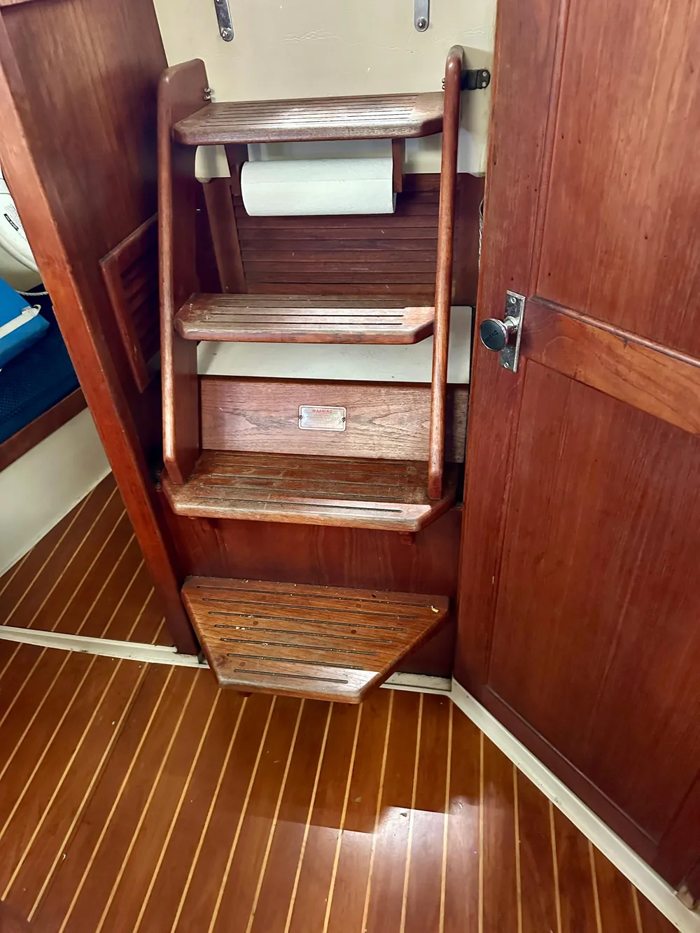 Wooden stairs in a 1987 Catalina 34 yacht.