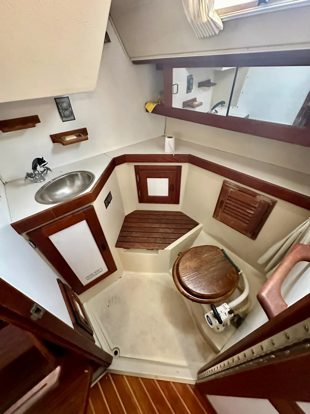 Interior of a 1987 Catalina 34 yacht with wooden accents.