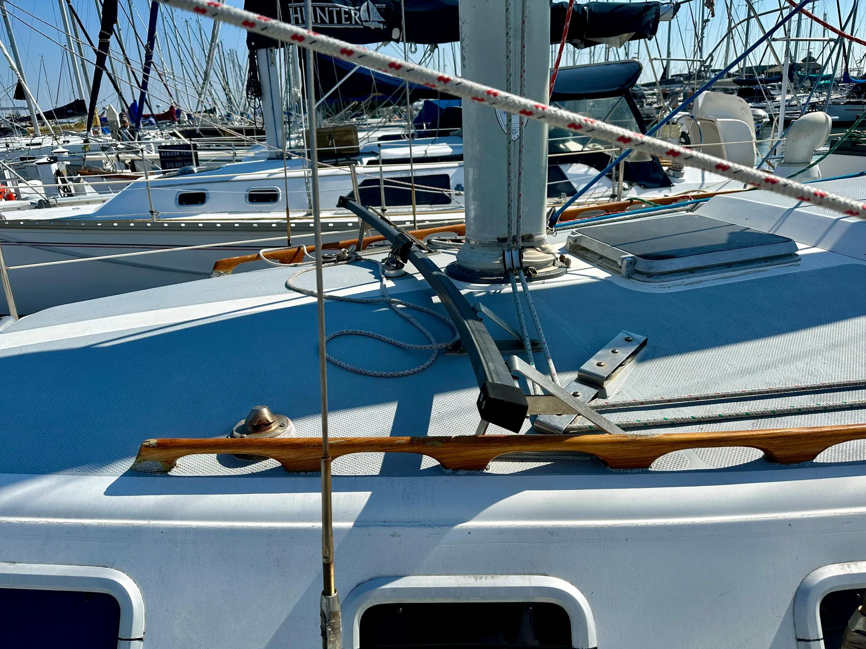 Deck of a 1987 Catalina 34 sailboat in harbor.