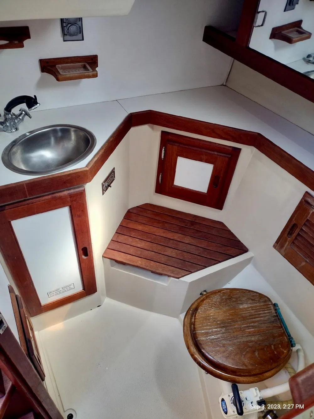 Interior of a 1987 Catalina 34 yacht with wood trim.