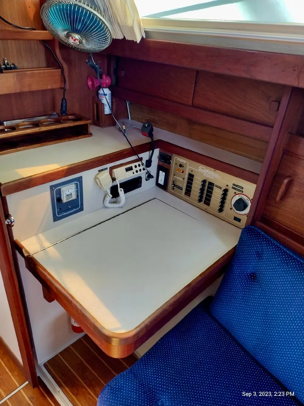 Navigation area of a 1987 Catalina 34 yacht with controls and seating.