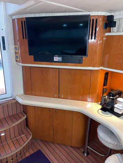 Pal'party Yacht Photos Pics Interior of 2000 Sea Ray 450 Express Bridge with TV and coffee station.