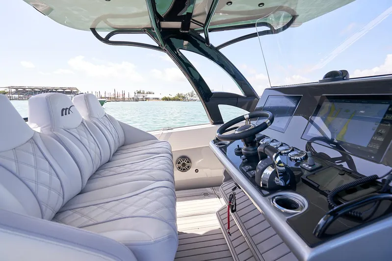  Yacht Photos Pics 2020 Midnight Express 37' Open boat interior with luxurious seating and advanced navigation controls.