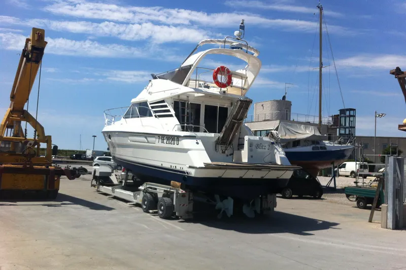  Yacht Photos Pics 1994 Fairline Phantom 37 yacht on trailer at marina, clear sky background.