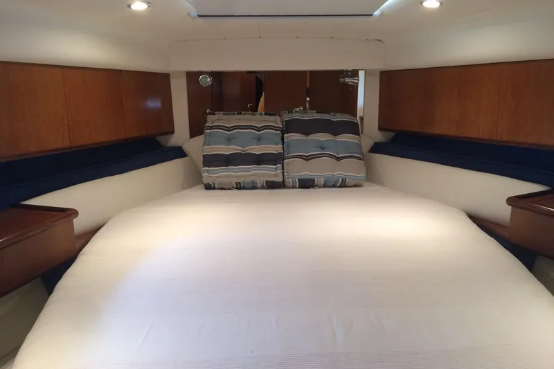  Yacht Photos Pics Cozy cabin interior of 1994 Fairline Phantom 37 yacht with plush bedding.
