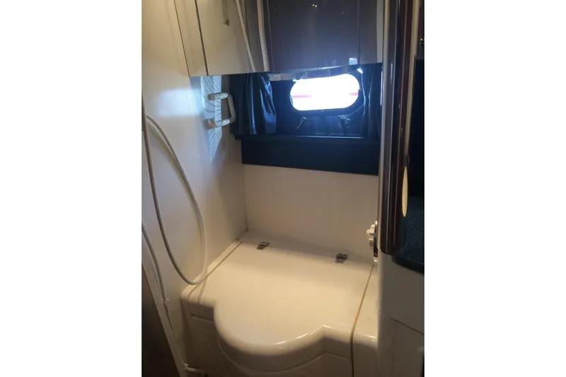  Yacht Photos Pics Bathroom interior of 1994 Fairline Phantom 37 yacht with window and shower.