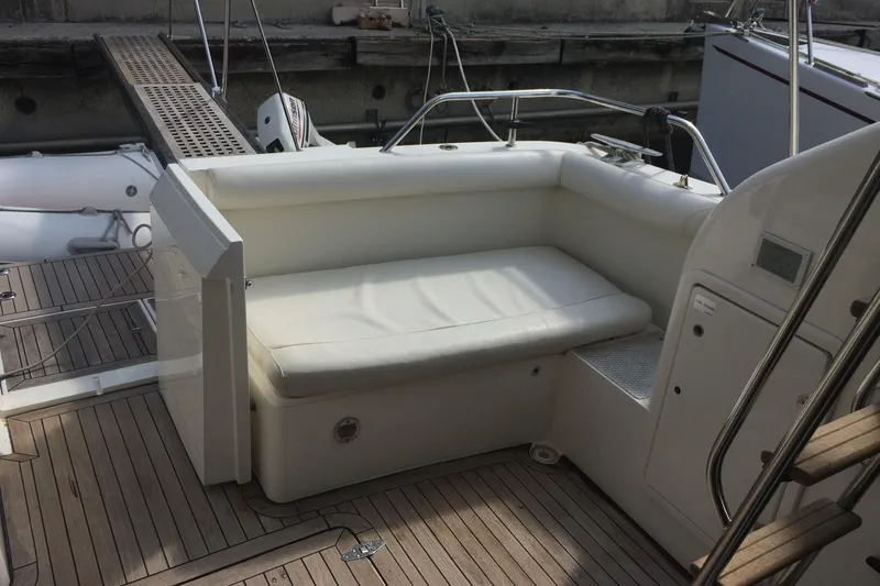  Yacht Photos Pics 1994 Fairline Phantom 37 yacht with white seating and wooden deck.