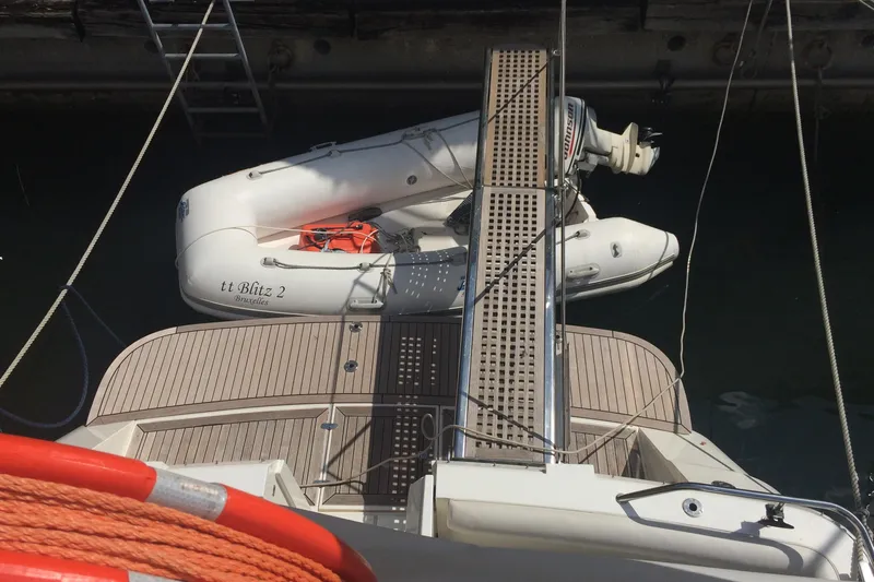  Yacht Photos Pics 1994 Fairline Phantom 37 yacht with dinghy and boarding ramp at dock.