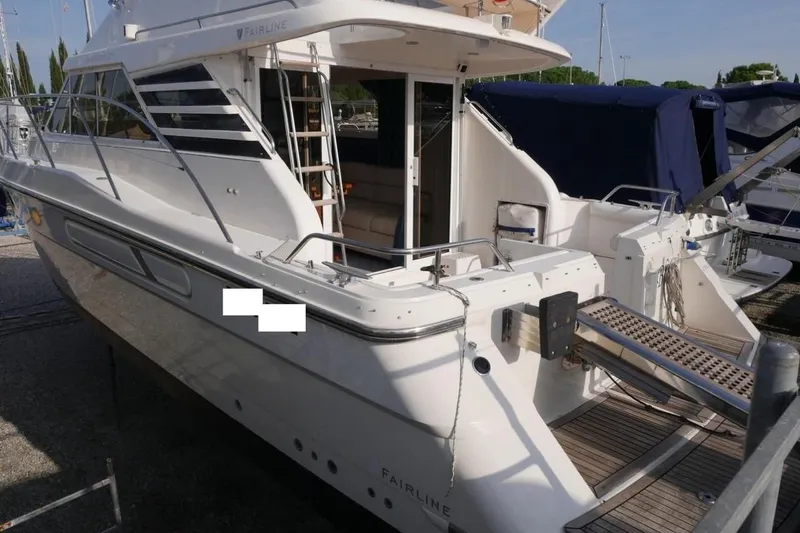  Yacht Photos Pics 1994 Fairline Phantom 37 yacht with sleek design and spacious deck.