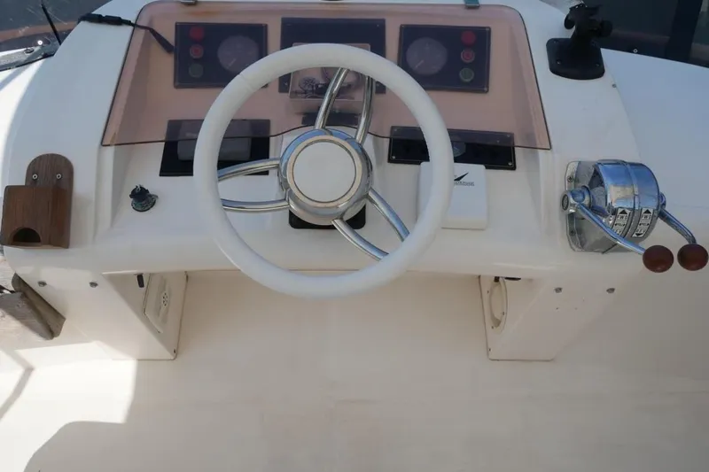  Yacht Photos Pics 1994 Fairline Phantom 37 helm with steering wheel and control panel.