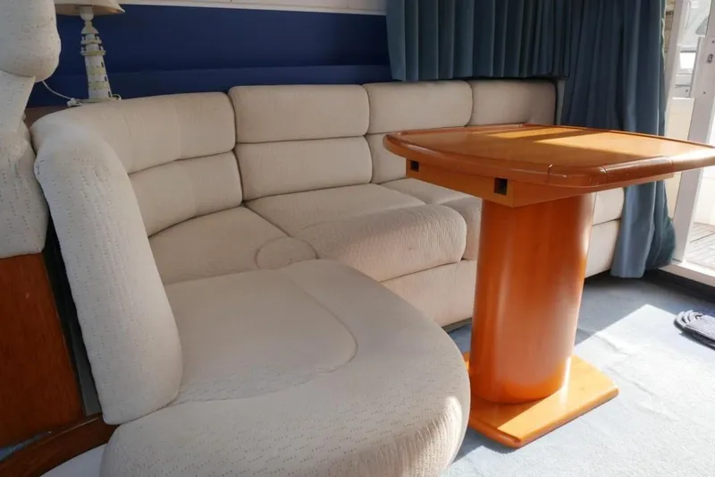  Yacht Photos Pics Luxurious interior of 1994 Fairline Phantom 37 yacht with beige seating and wooden table.