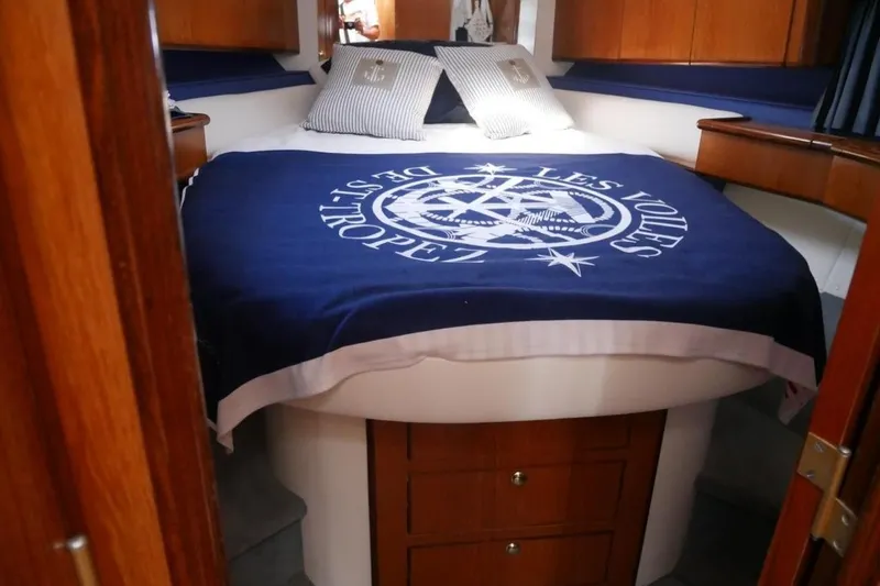  Yacht Photos Pics Cozy cabin interior of 1994 Fairline Phantom 37 yacht with nautical bedding.