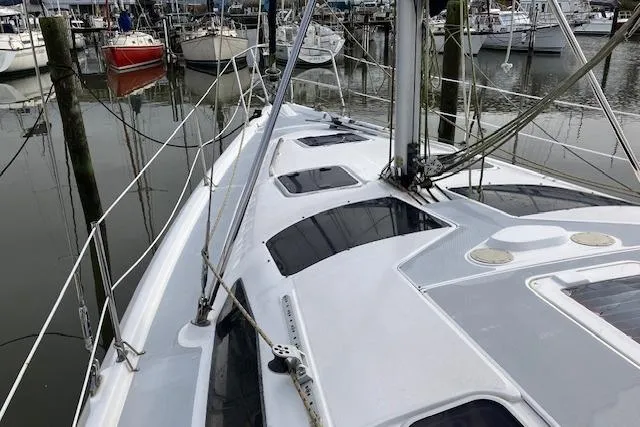 Sailboat deck view of 2000 Hunter 380 model docked in a marina.