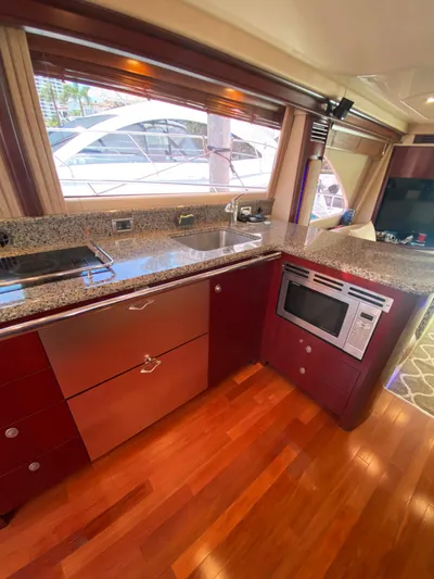 Blue Pearl Yacht Photos Pics Luxurious kitchen interior of 2006 Sea Ray 580 Sedan Bridge yacht with modern appliances.