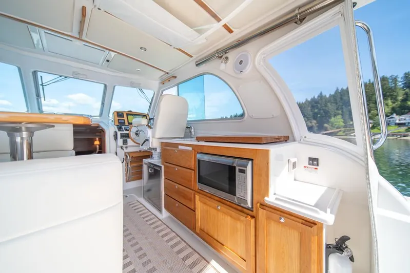 Eastern Standard Yacht Photos Pics Interior of 2021 Back Cove 34O yacht with modern kitchen and scenic window view.