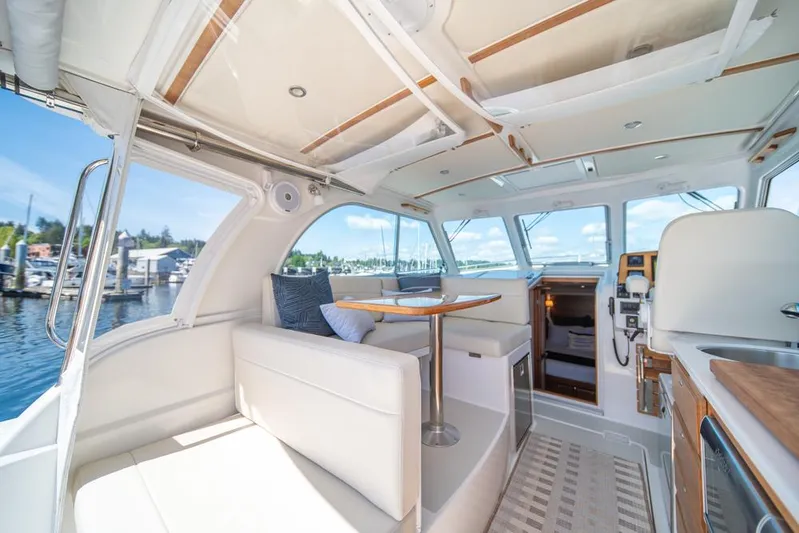 Eastern Standard Yacht Photos Pics Interior of 2021 Back Cove 34O yacht with elegant seating and dining area.