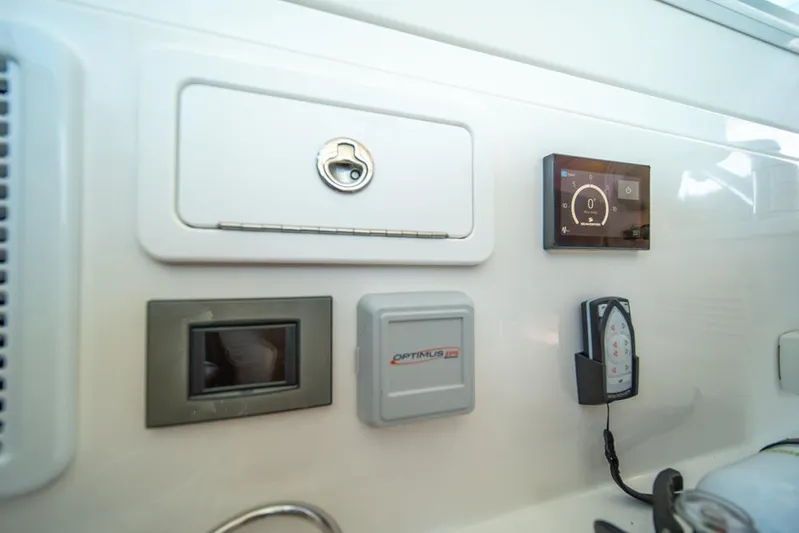 Eastern Standard Yacht Photos Pics Control panel of 2021 Back Cove 34O boat with various electronic displays and switches.