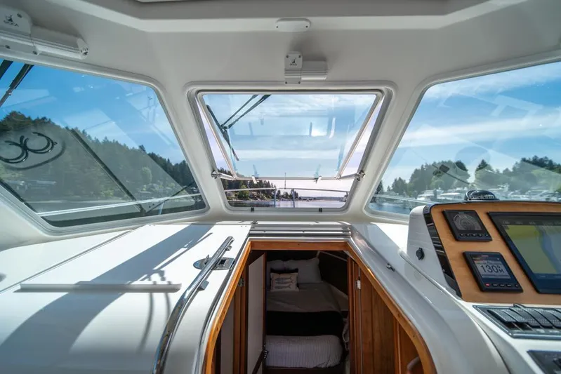 Eastern Standard Yacht Photos Pics Interior view of 2021 Back Cove 34O boat, showcasing cabin and navigation equipment.