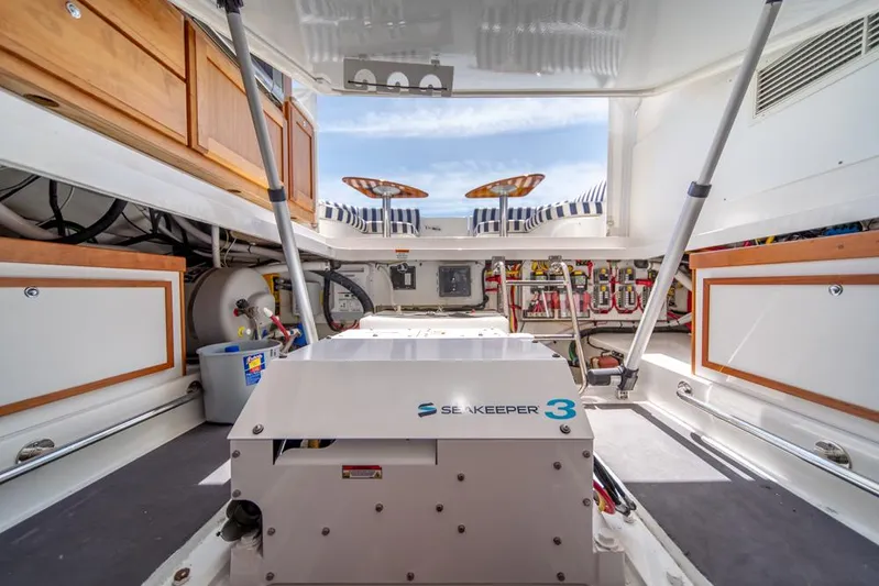 Eastern Standard Yacht Photos Pics 2021 Back Cove 34O engine room with Seakeeper 3 stabilizer, showcasing organized layout and equipment.