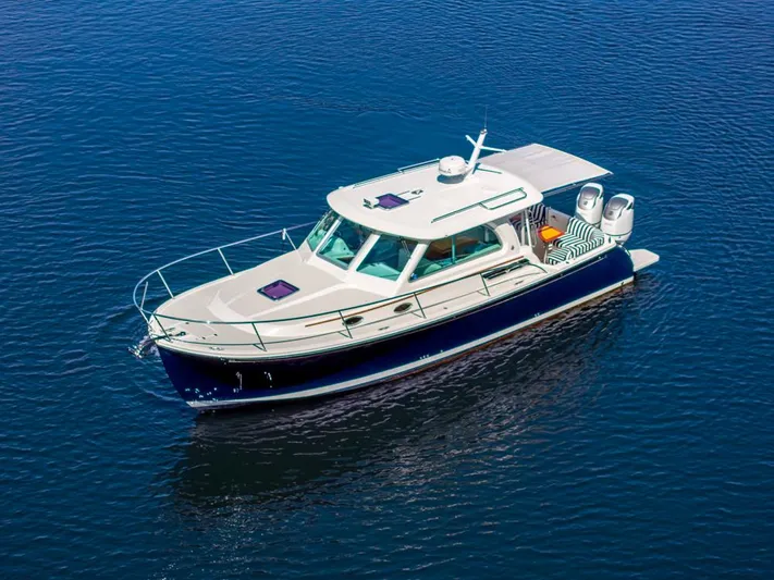 Eastern Standard Yacht Photos Pics 2021 Back Cove 34O boat on calm blue water, aerial view.