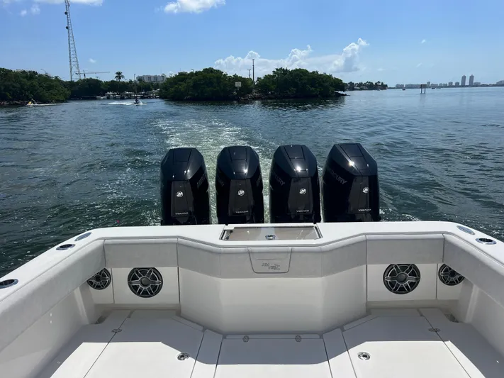  Yacht Photos Pics 2024 SeaVee 390Z boat with four powerful outboard engines on open water.