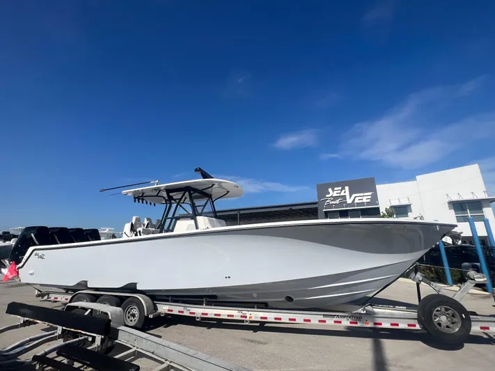  Yacht Photos Pics 2024 SeaVee 390Z boat on trailer under clear blue sky.