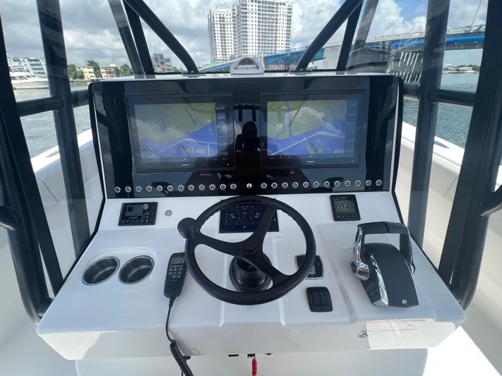  Yacht Photos Pics 2024 SeaVee 390Z helm with dual navigation screens and modern controls.