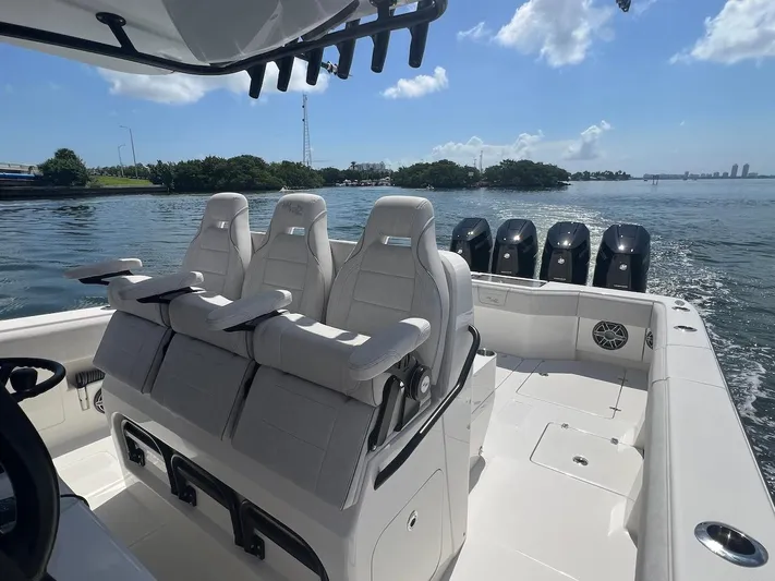  Yacht Photos Pics 2024 SeaVee 390Z boat with triple seats and multiple outboard engines on a sunny day.