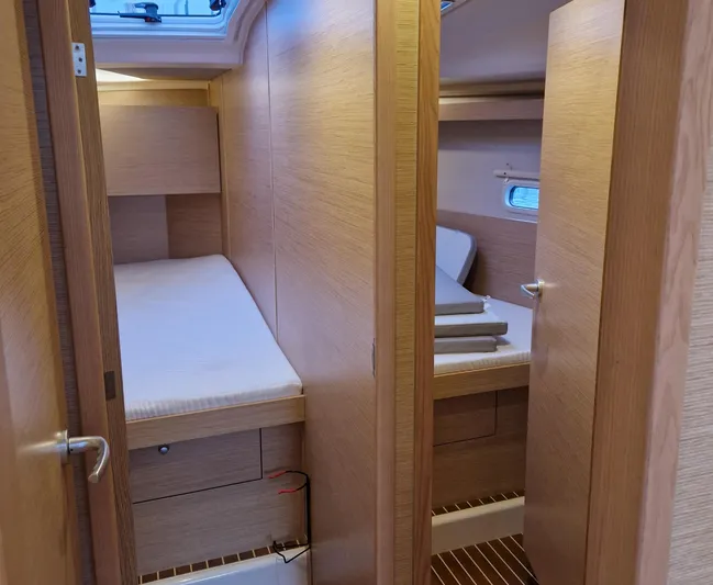  Yacht Photos Pics Interior of 2020 Hanse 458 yacht with two cozy wooden cabins.