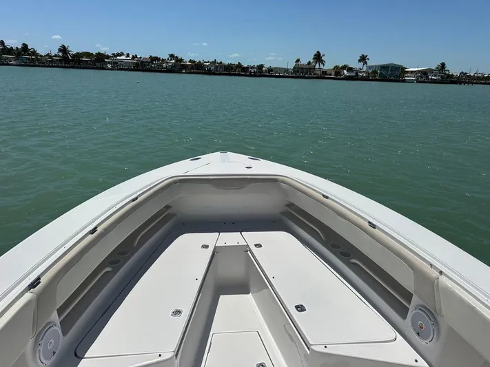  Yacht Photos Pics Bow view of 2009 Jupiter 29 FS CC boat on calm water.