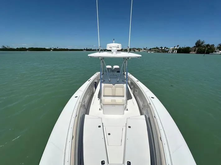  Yacht Photos Pics 2009 Jupiter 29 FS CC boat on calm water, clear sky, and distant shoreline.