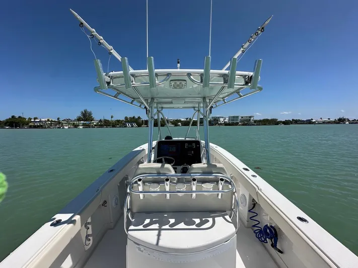 Yacht Photos Pics 2009 Jupiter 29 FS CC boat on calm water under clear blue sky.