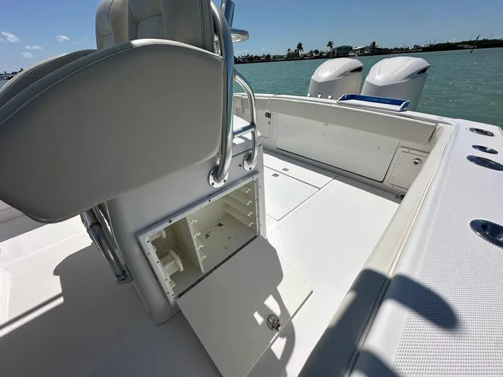  Yacht Photos Pics 2009 Jupiter 29 FS CC boat interior with open storage compartment, dual engines, and ocean view.